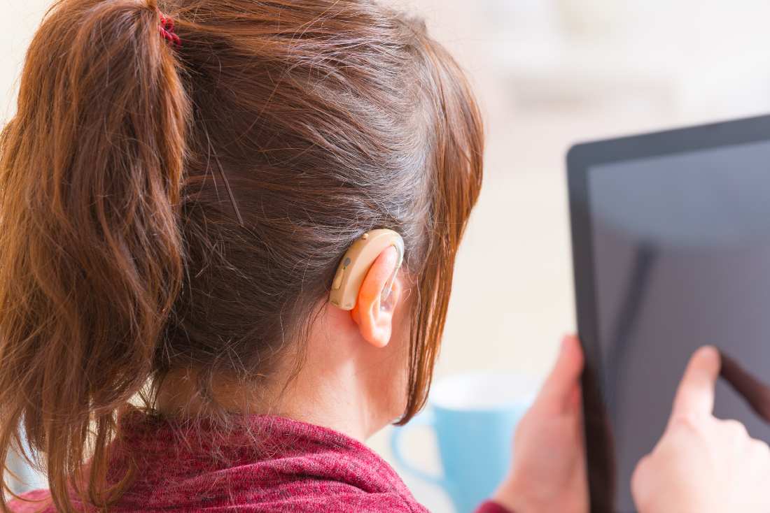 a deaf woman using a tablet