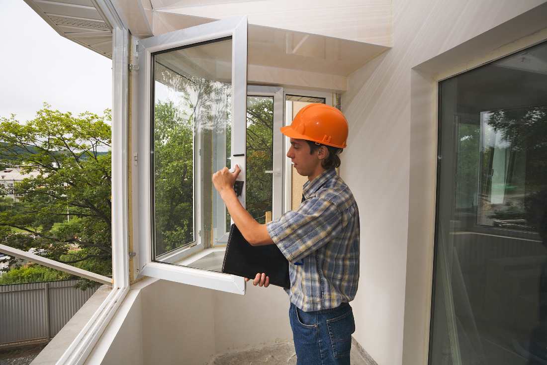 building inspector checking windows