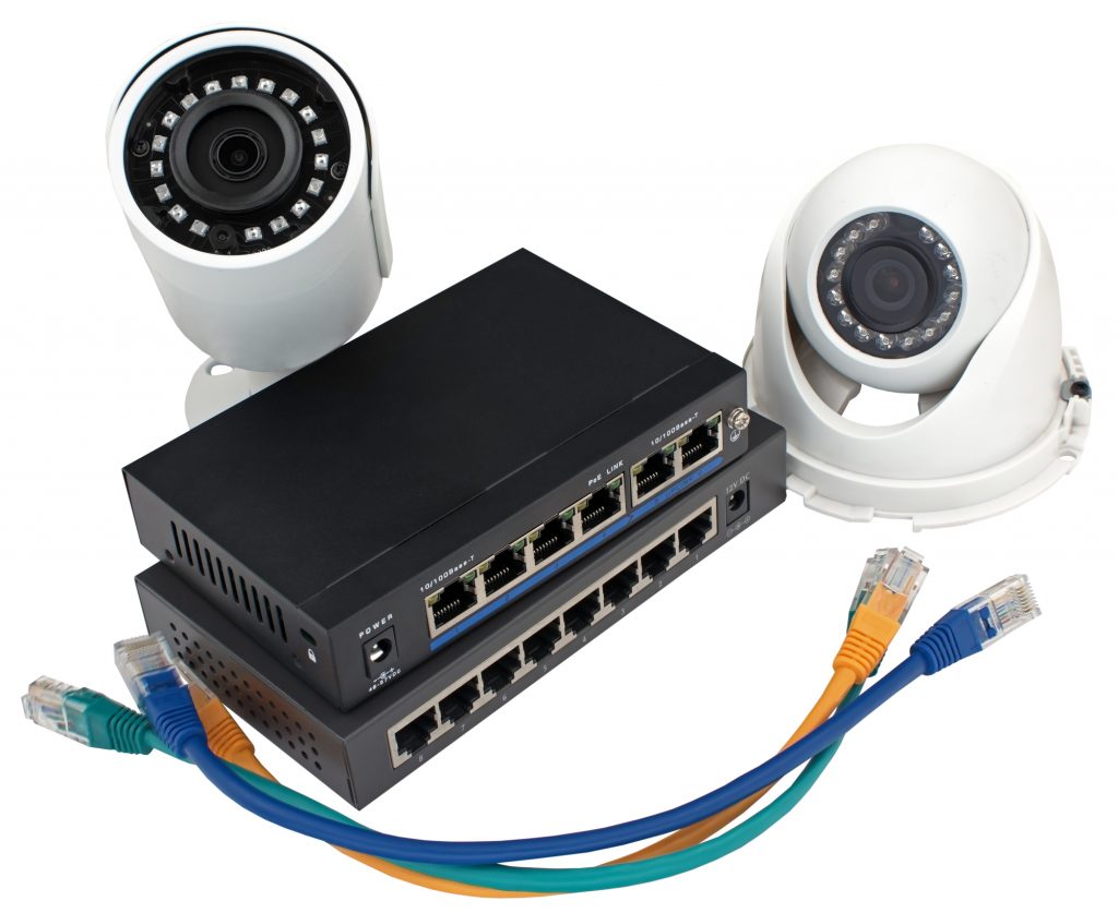 IP security cameras, LAN cables and routers on white background